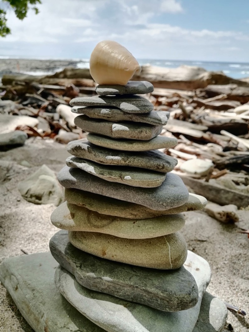 A stack of balanced stones on the rocky beach at Mal País